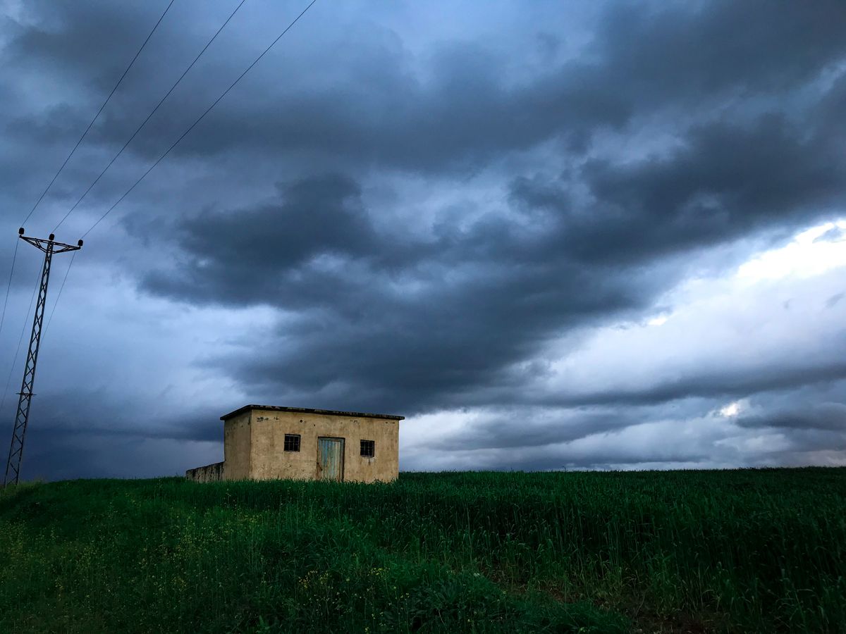 Dark storm clouds gathering over a home