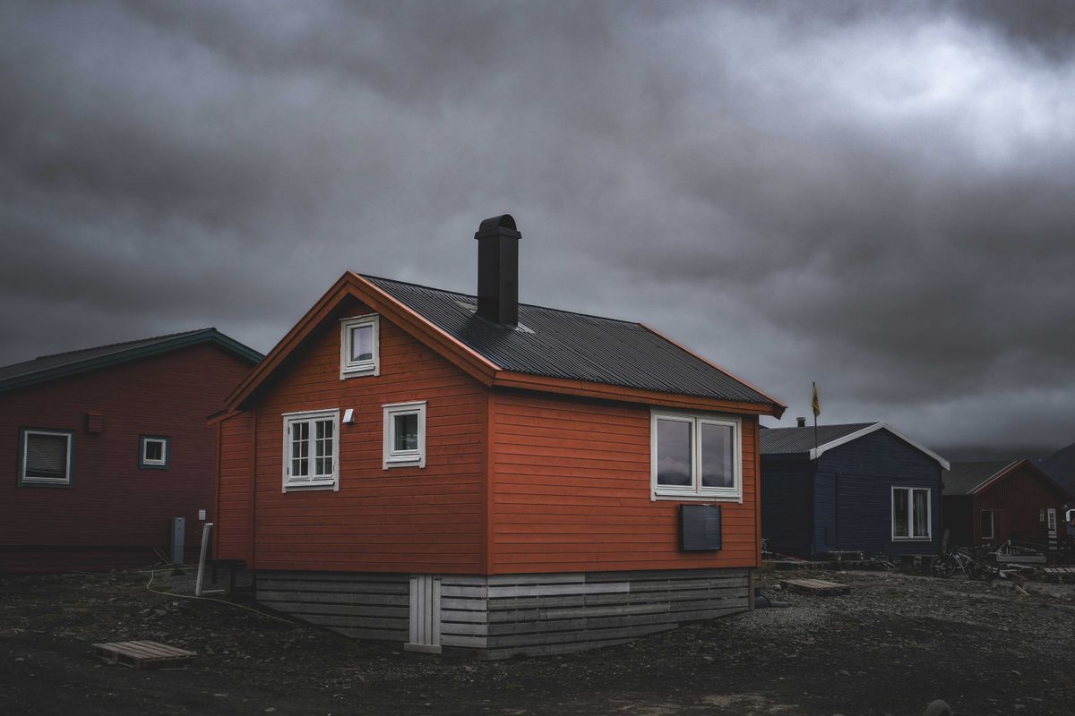 A home under a heavy storm sky